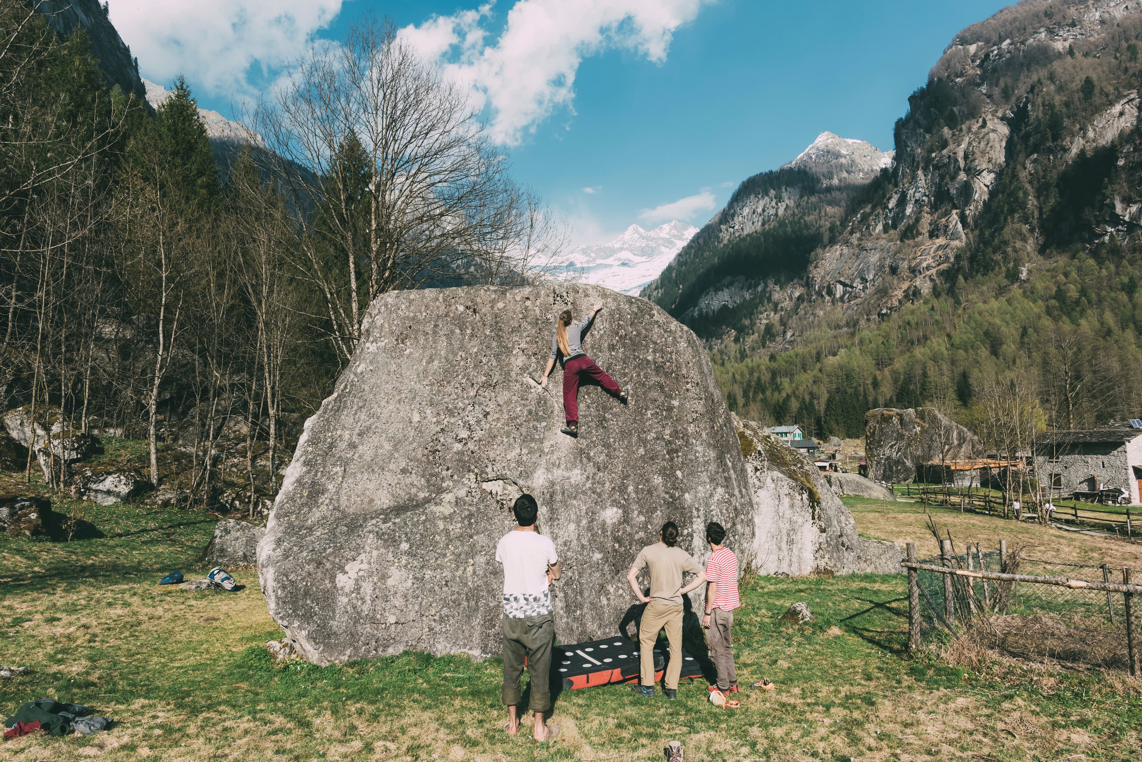 Daniel and a small group bouldering on real rock in the forest